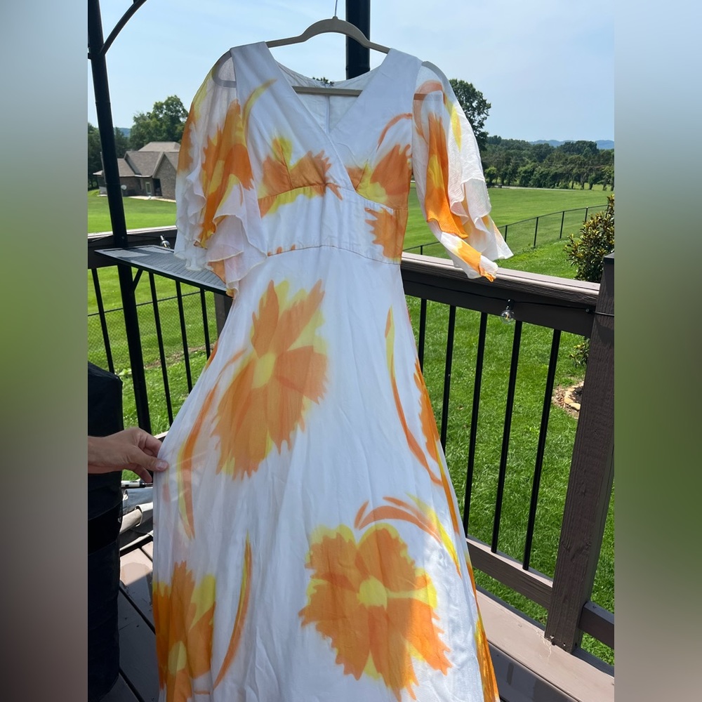 Beautiful Vintage 70’s Futura Couture in orange floral sunburst print.